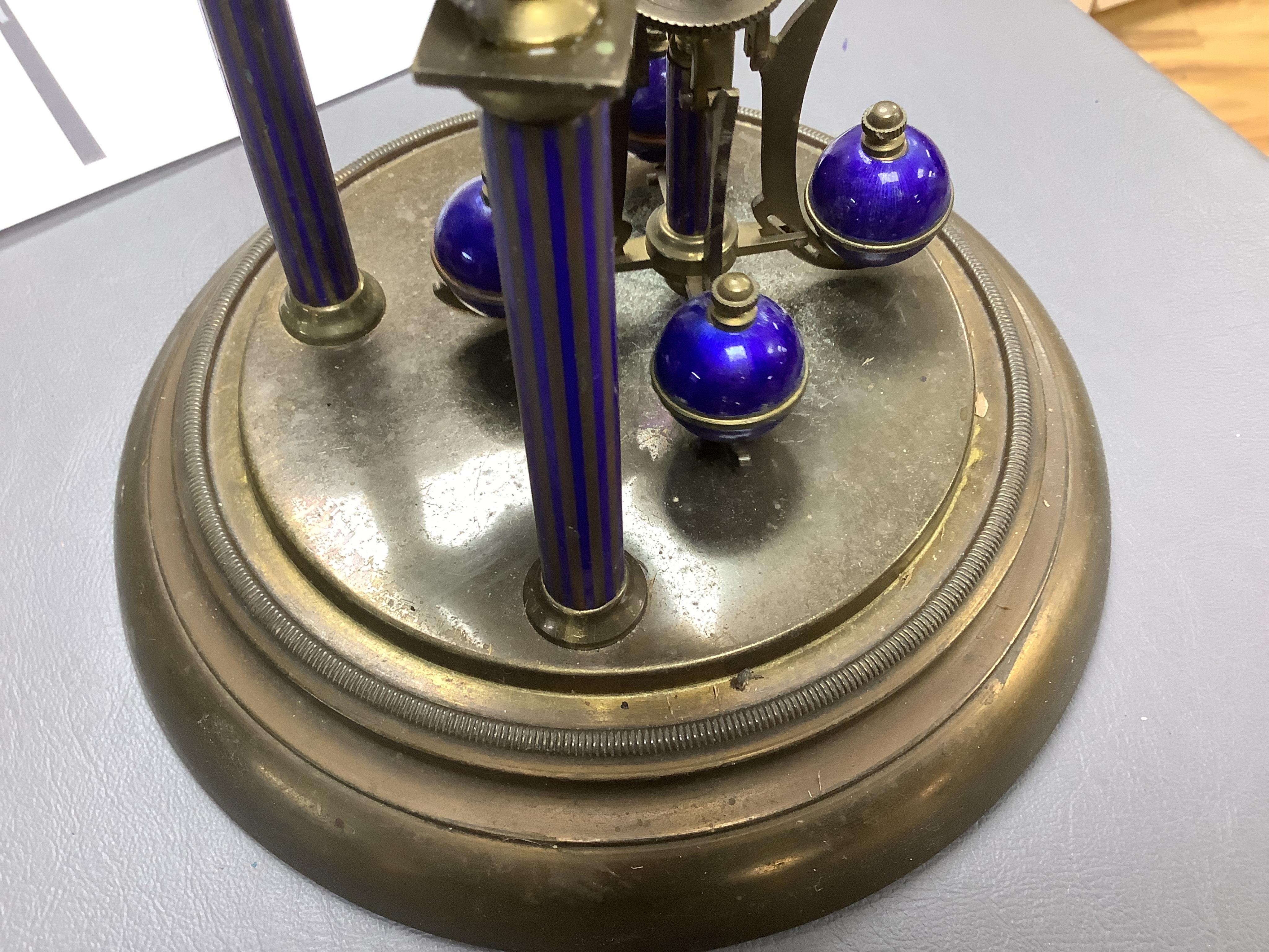 A Jahresuhrenfabrik anniversary clock with blue-enamelled dial, under glass dome, 32cm